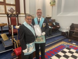 W. Bro. Ed Richings presenting Bro. Tommy Tucker with his certificate of commendation recognising all the hard work he does for the lodge as it's excellent Almoner