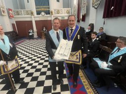 Bro. Mark Besley being presented his Master Mason's Certificate by W. Bro. Mike Norton
